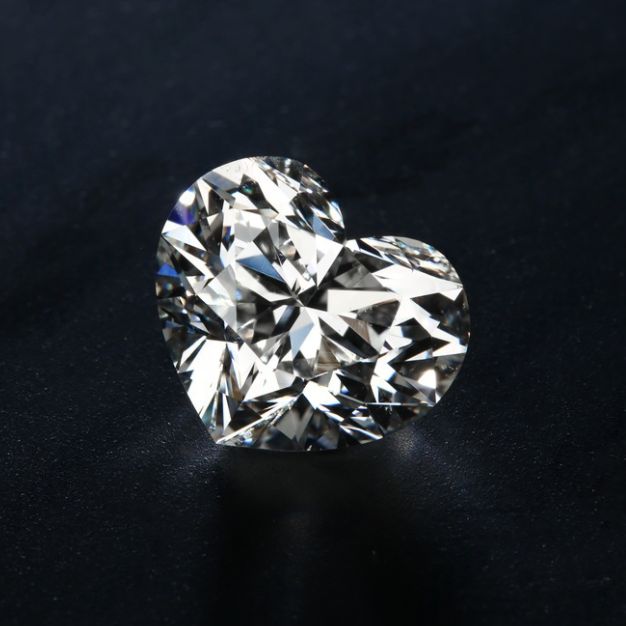 Heart shaped diamond with certified clarity and color grades.